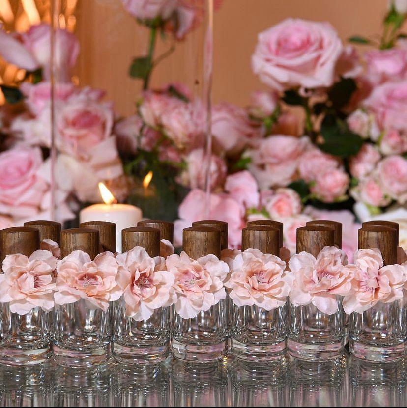 Perfume bottles with pink flowers